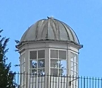 turret with glass windows and fence